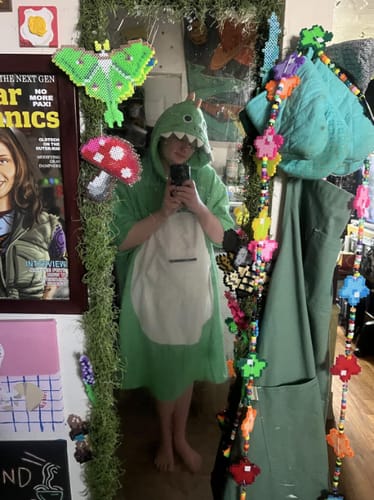 Customer photo review of OLAOLA Green Dinosaur Surf Poncho Changing Towel Swim Robe Quick Dry Terry Cloth Cover-Up Hood Blanket Beach Towels
