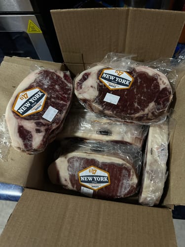 Reseña con foto de un cliente sobre New York Steak