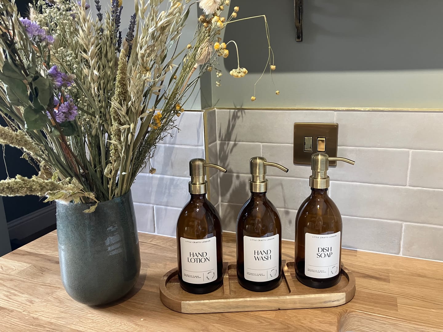 Customer photo review of Set of 3 Reusable Amber Glass Bottles 500 ML with Stainless Steel Pump and Long Tray