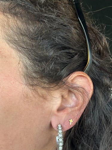 Customer photo review of Tiny Cross Stud Earrings