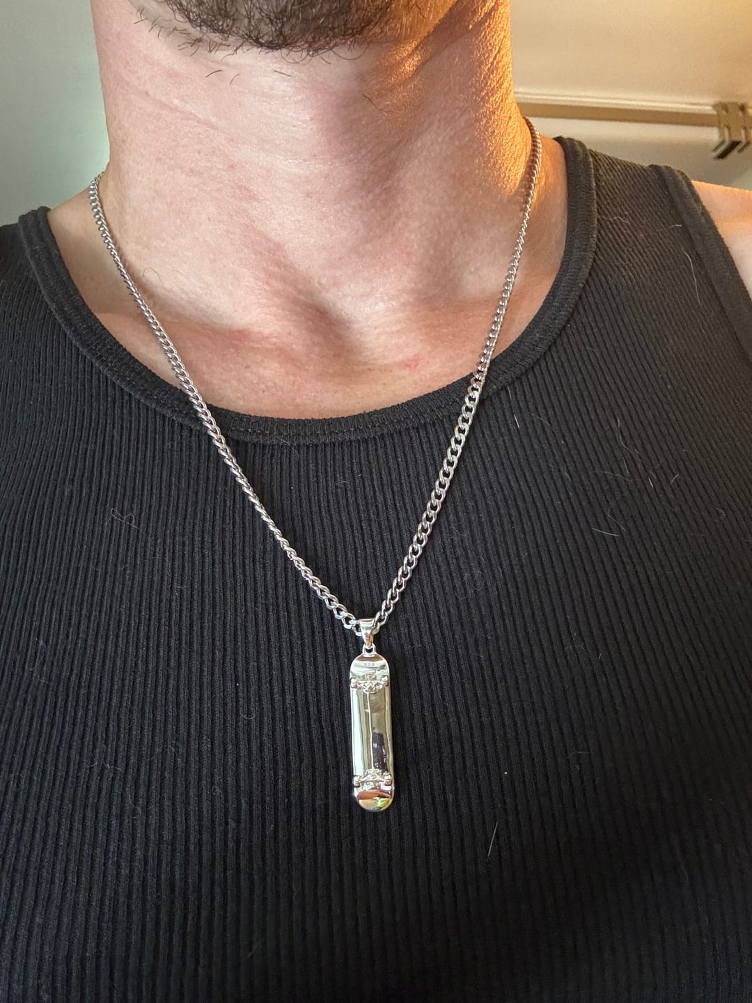 Customer photo review of Skateboard Pendant (Silver)
