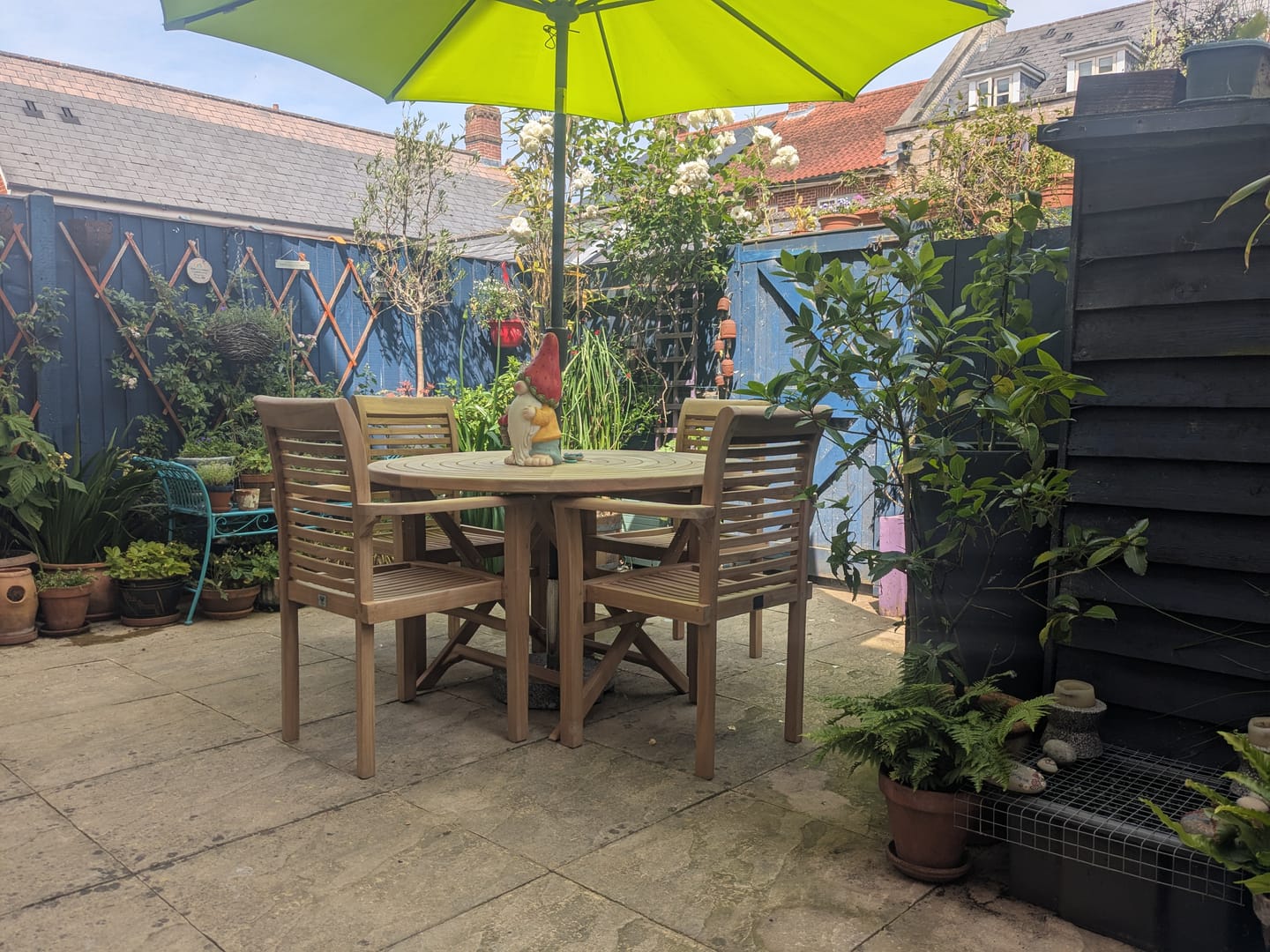 Customer photo review of Teak Garden Furniture Set 120cm Round Sunshine Table 4 x Oxford Stacking Chairs Cushions Included