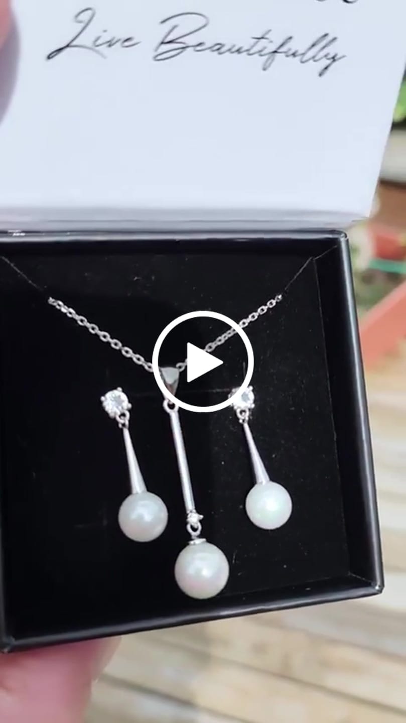 Customer video review of Tatum 18k White Gold Plated Pearl Dangling Stud Earrings with Swarovski Crystal