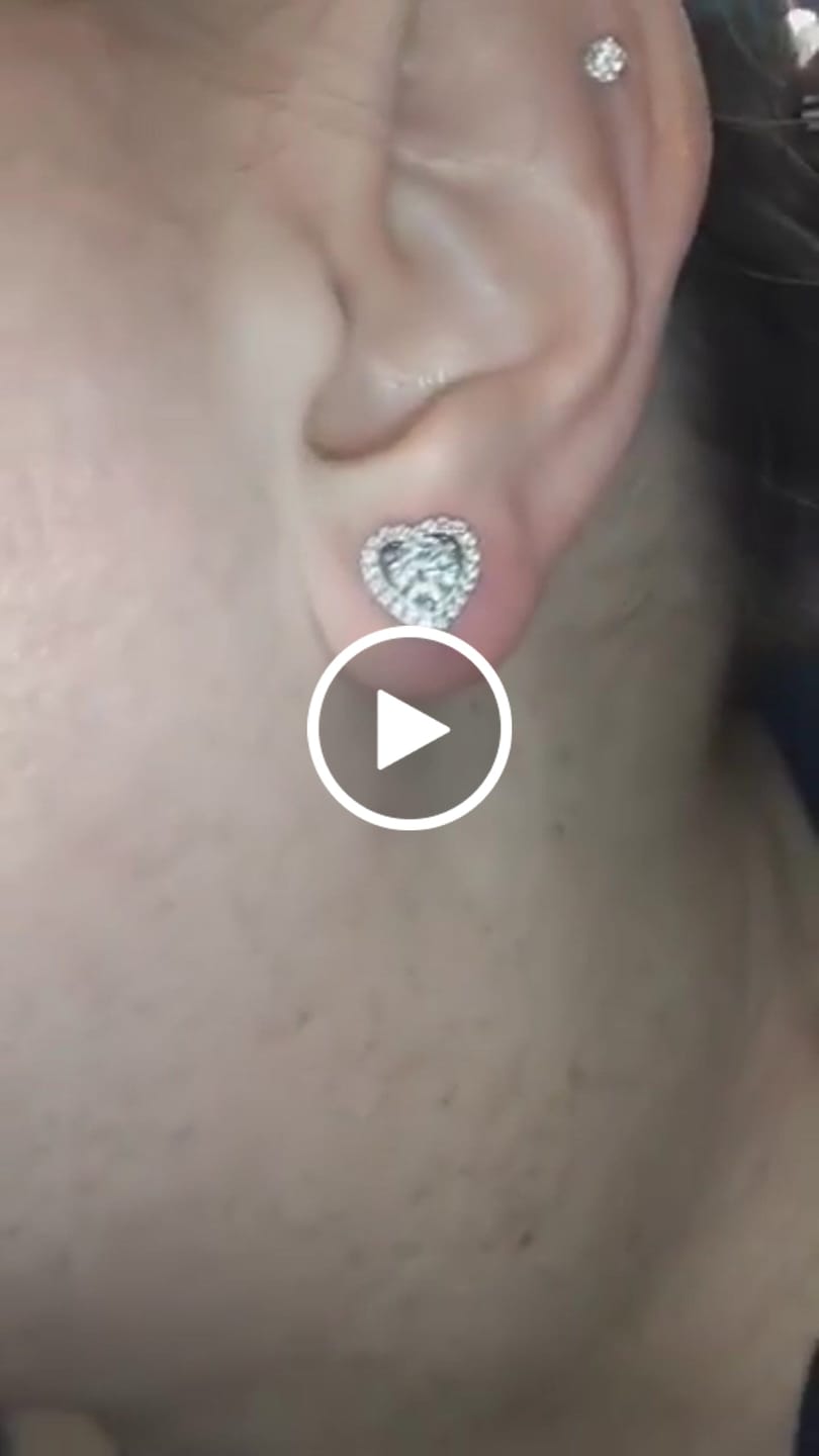 Customer video review of Coraline 18k White Gold Plated Silver Heart Stud Earrings with Simulated Diamond Crystals