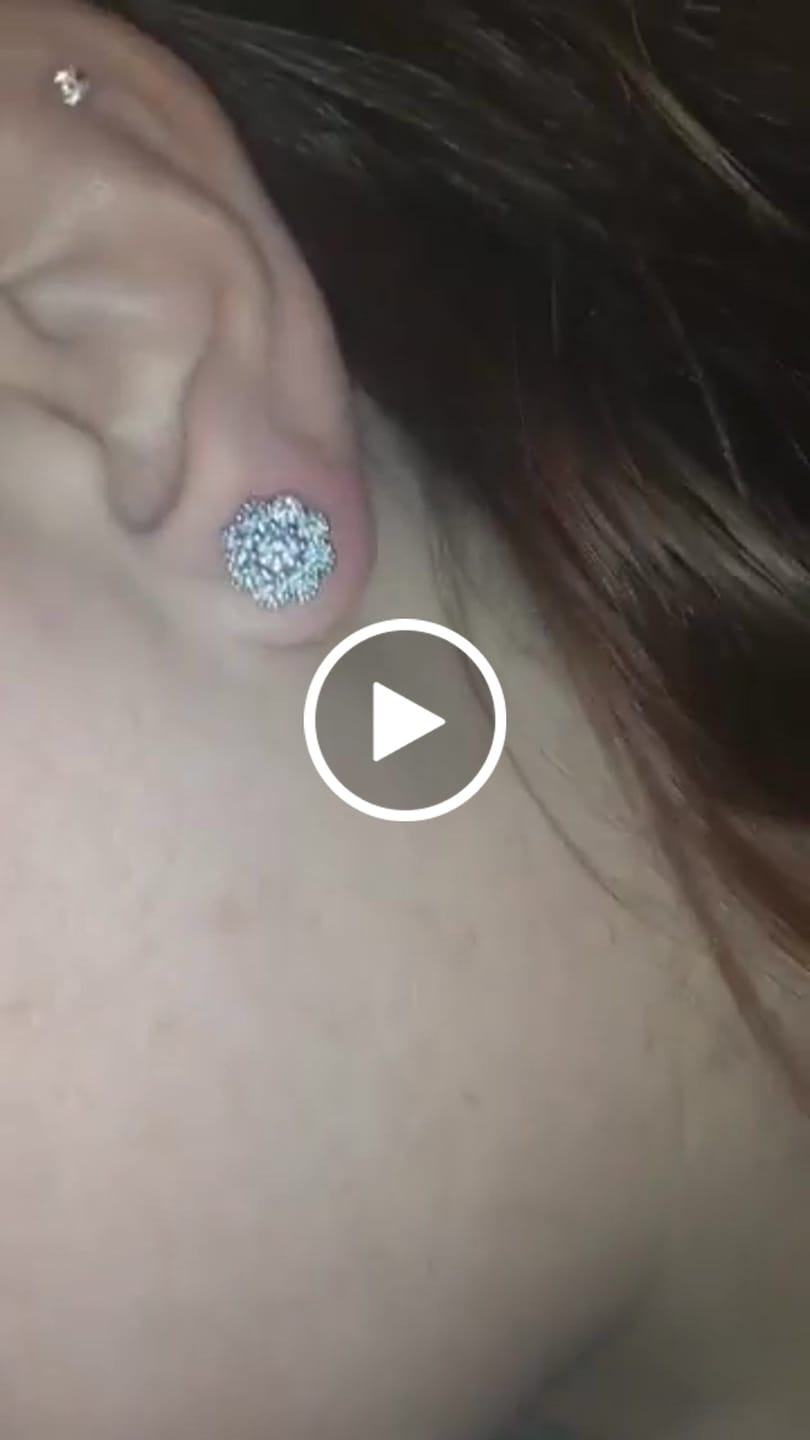Customer video review of Alyssa 18k White Gold Plated Flower Stud Earrings with Simulated Diamond Crystals