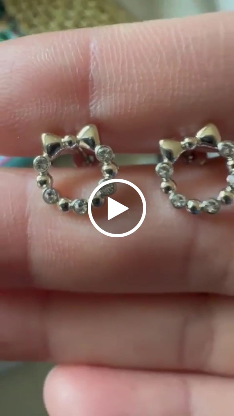 Customer video review of Edith 18k White Gold Plated Silver Ribbon Stud Earrings with Swarovski Crystals