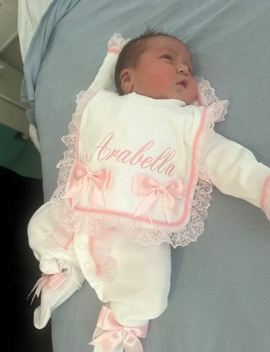 Gemma B. review of Perfect Little Thing Baby Girls Handmade Frill Sleepsuit With Bib - Pink image 1 out of 1