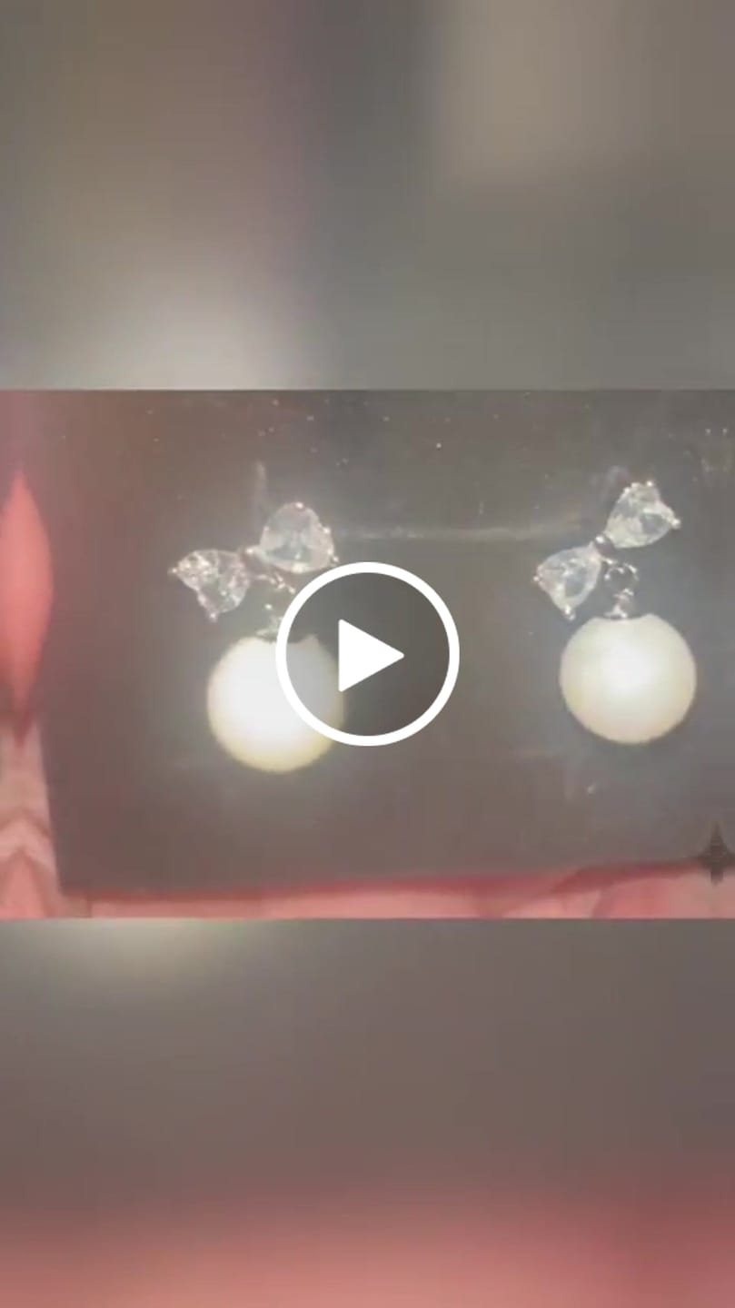 Customer video review of Oakley 18k White Gold Plated Silver Drop Pearl Earrings with Swarovski Crystals