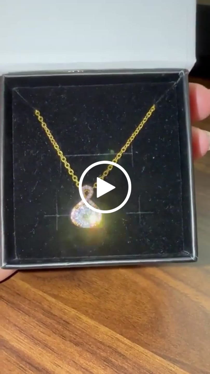 Customer video review of Alessandra 18k White Gold Plated Infinity Halo Pendant Necklace with Simulated Diamond Crystals