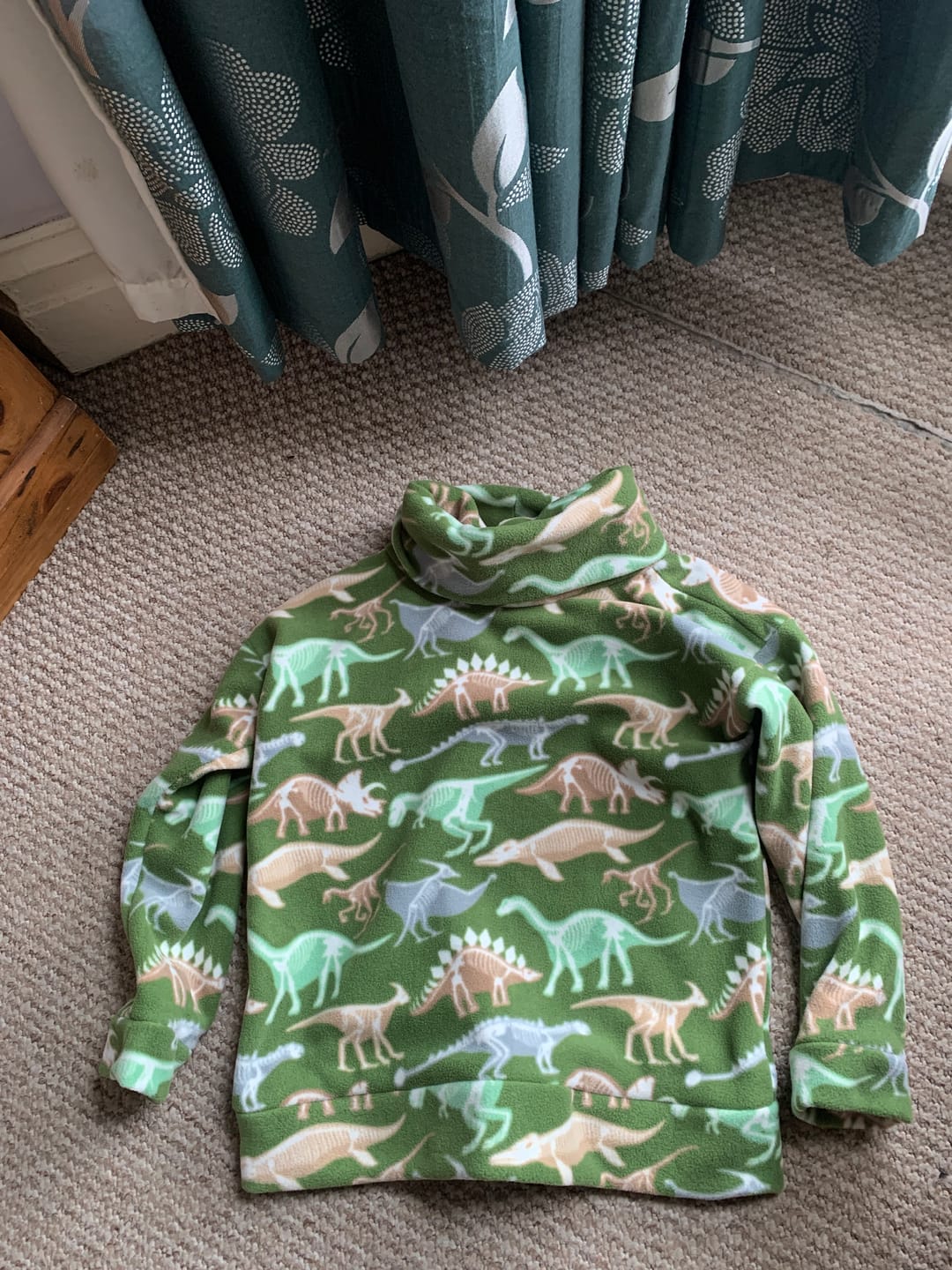 Customer photo review of Dino Skeletons on Green Anti Pill Polar Fleece Fabric