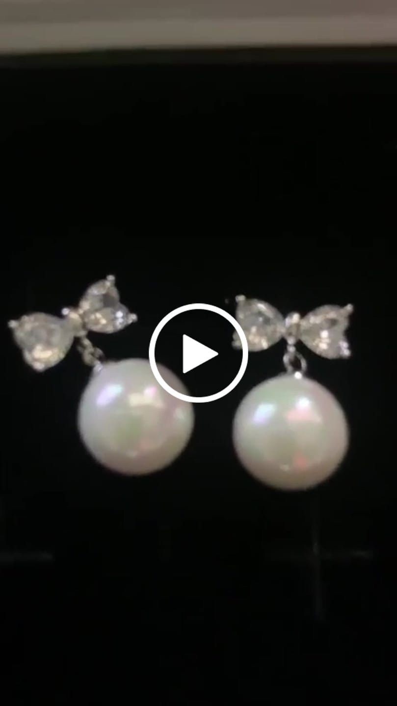Customer video review of Oakley 18k White Gold Plated Silver Drop Pearl Earrings with Swarovski Crystals