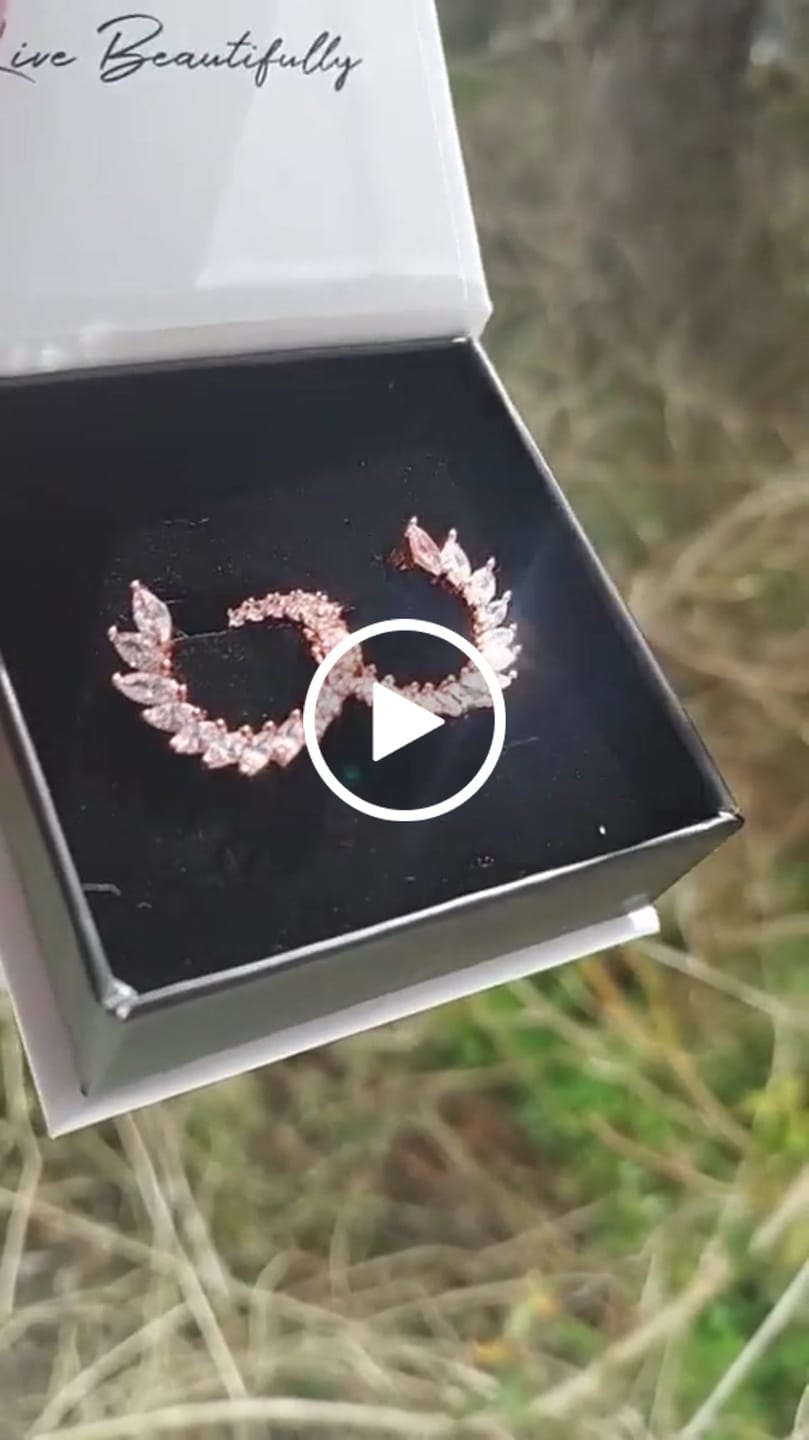 Customer video review of Adelyn 18k Gold Plated Sideways Hoop Earrings with Simulated Diamond Crystals — Final Sale