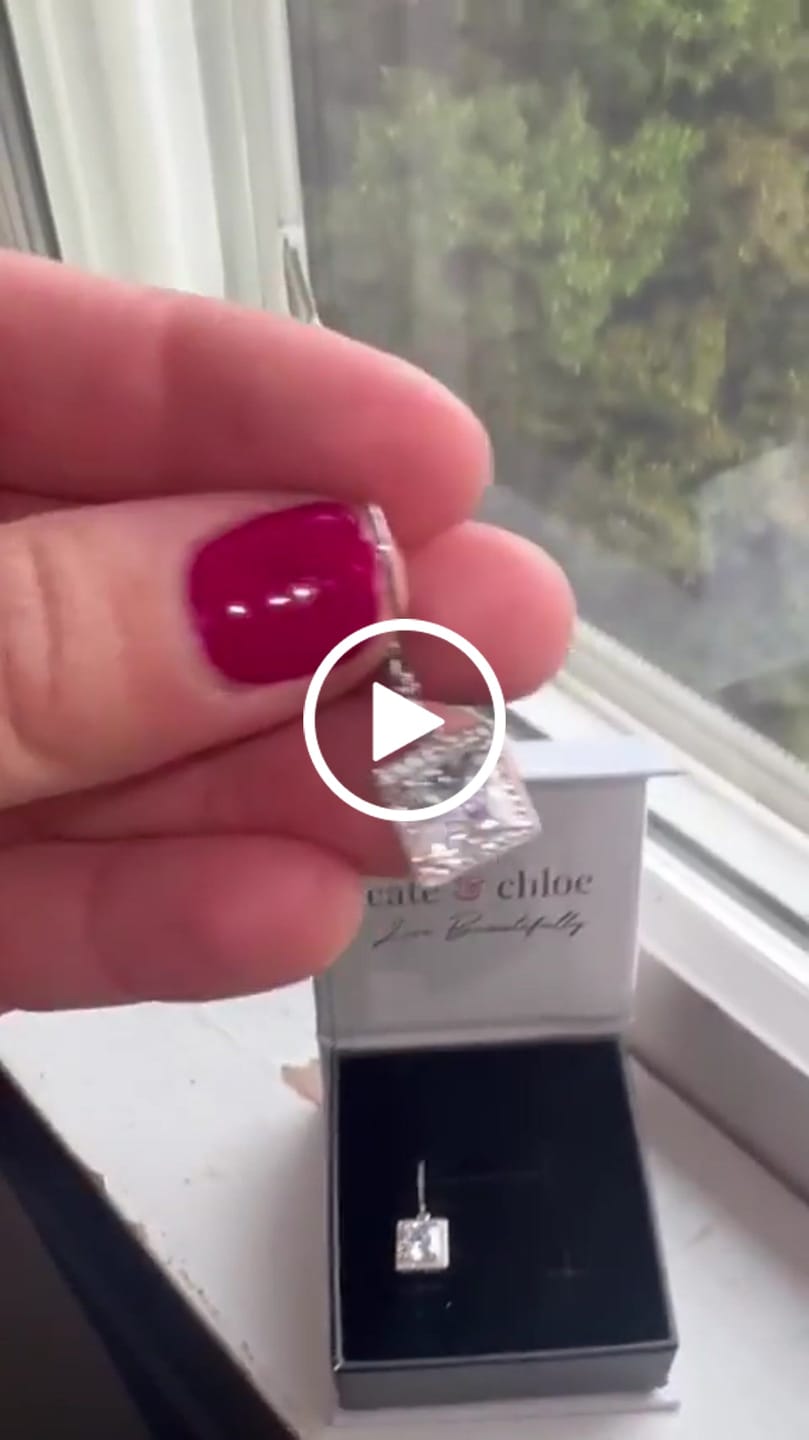 Customer video review of Maeve 18k White Gold Plated Drop Dangle Halo Earrings with Simulated Diamond Crystals