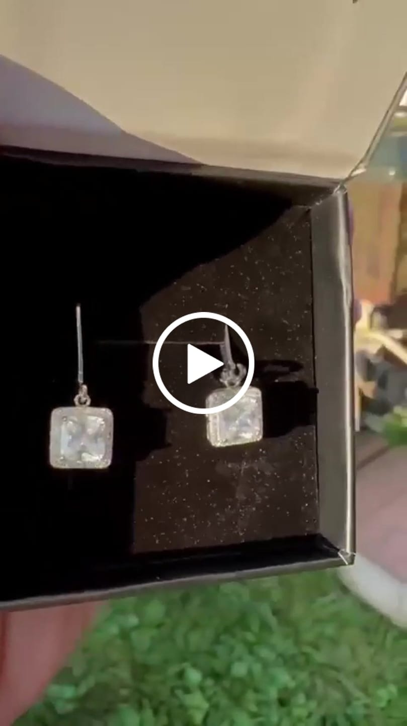 Customer video review of Maeve 18k White Gold Plated Drop Dangle Halo Earrings with Simulated Diamond Crystals