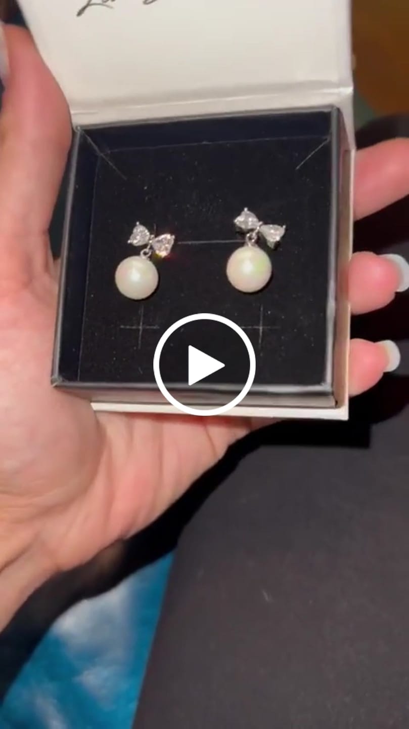Customer video review of Oakley 18k White Gold Plated Silver Drop Pearl Earrings with Swarovski Crystals