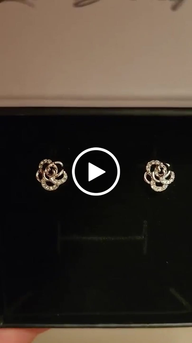 Customer video review of Briella 18k White Gold Plated Silver Flower Stud Earrings with Swarovski Crystals
