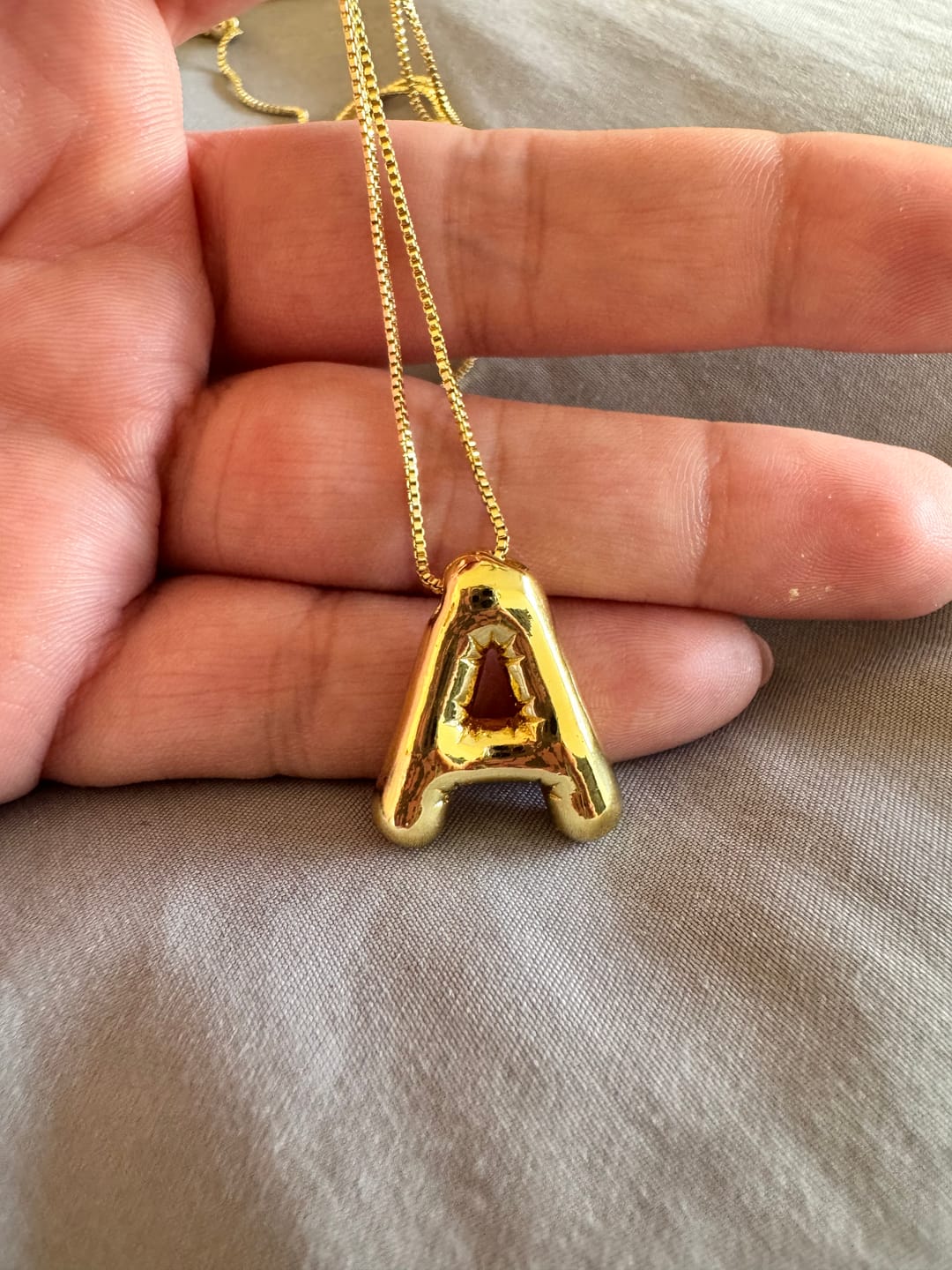 Customer photo review of Personaliza Tu Collar Con Inicial Mini Bubble Plateado