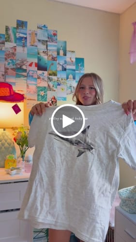 Customer video review of shark baby tee