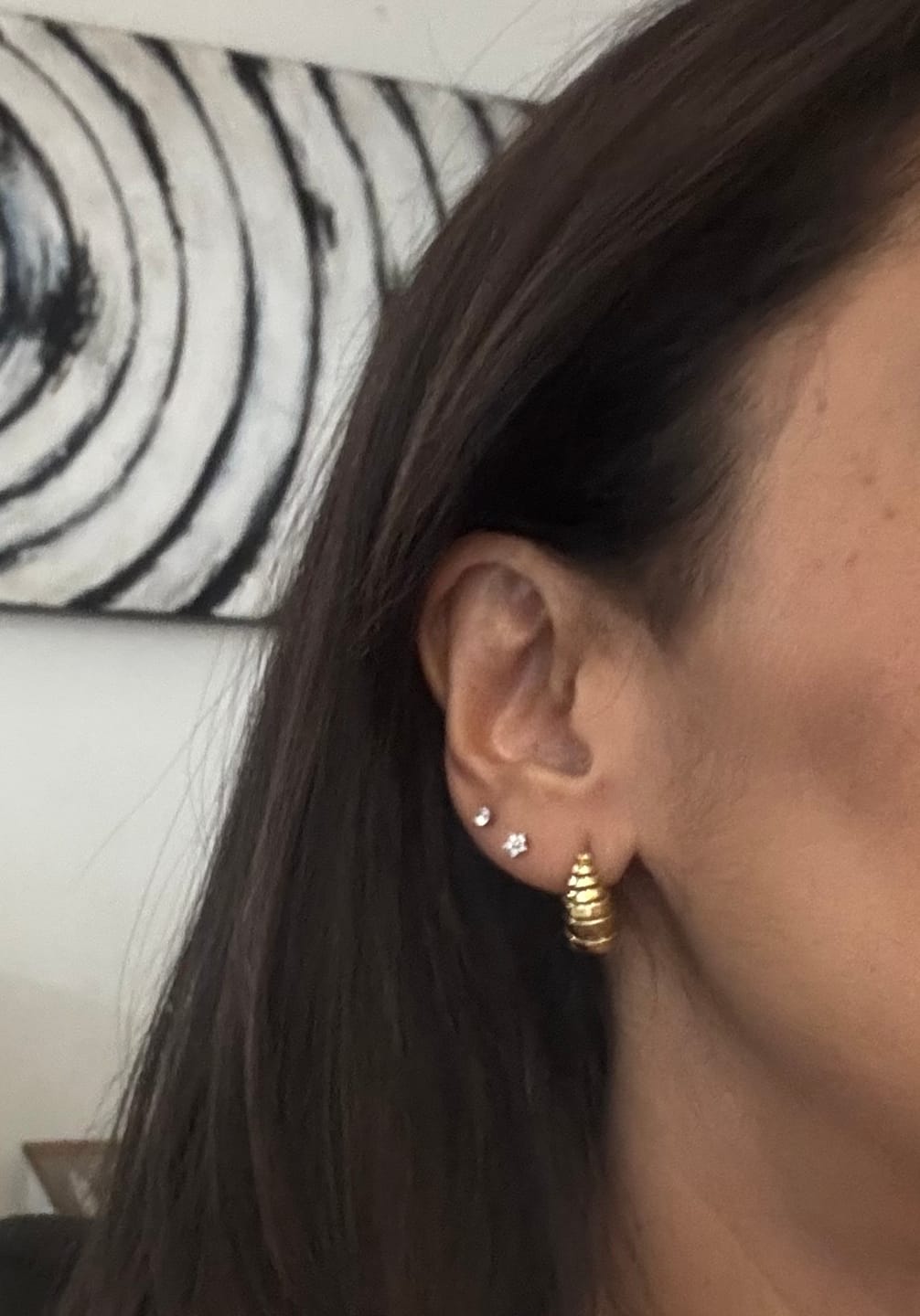 Customer photo review of Acero Quirúrgico Dorado Con Zirconias Primera Perforación