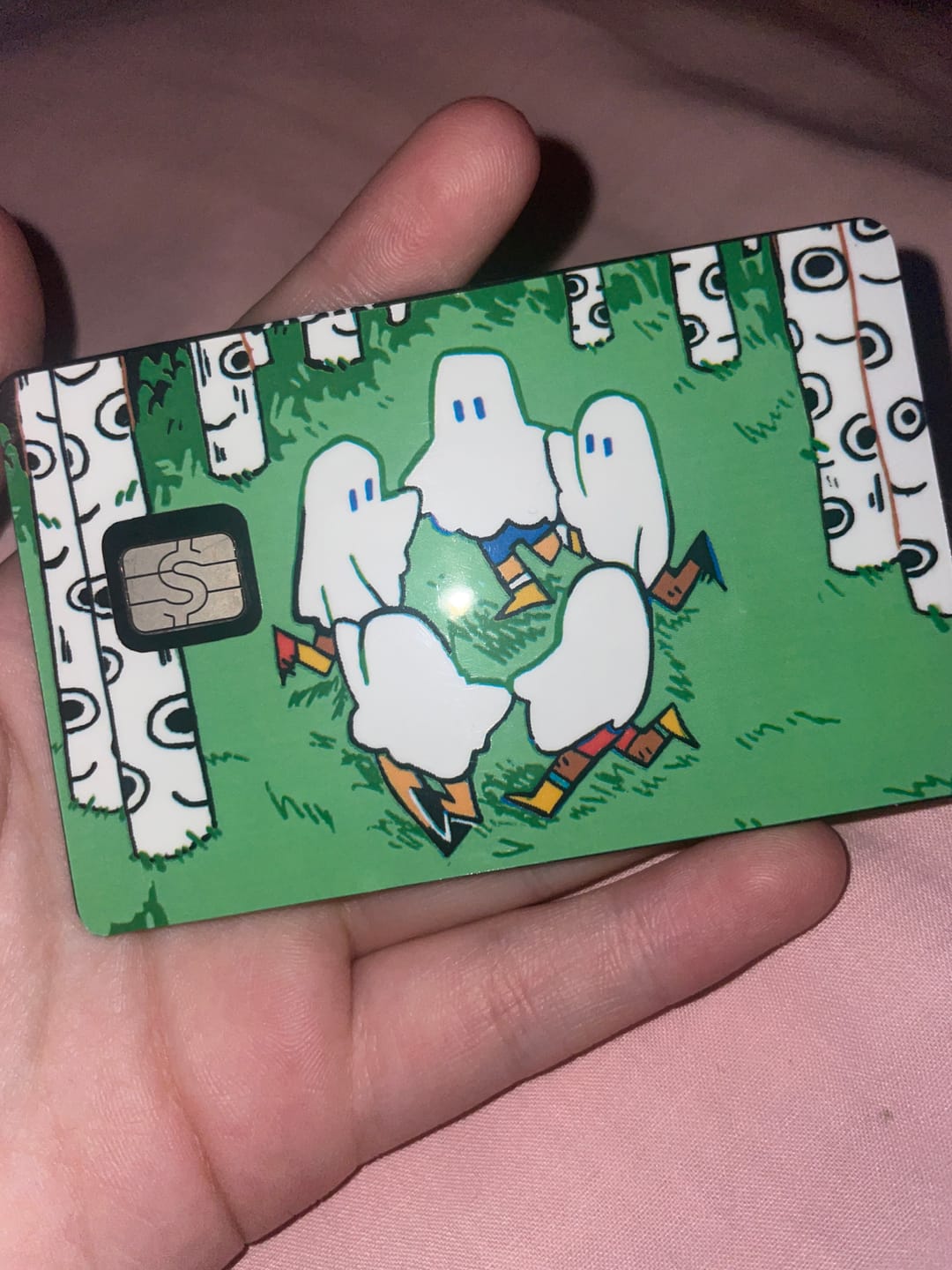 Customer photo review of Circle Ghosts Credit Card Skins