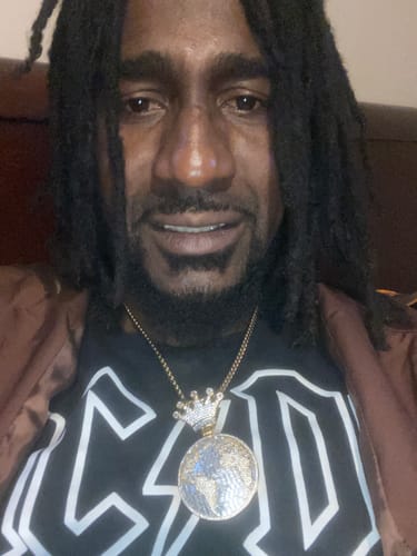 Customer photo review of World Globe Baguette VVS CZ Hip Hop Iced Out Pendant