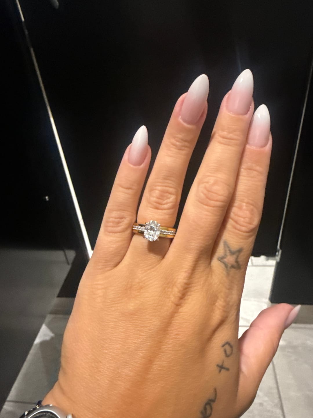 Customer photo review of Hidden Halo Oval Moissanite Three Row Two Tone Engagement Ring