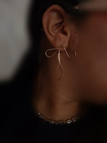 Customer photo review of Aretes de lazos dorados