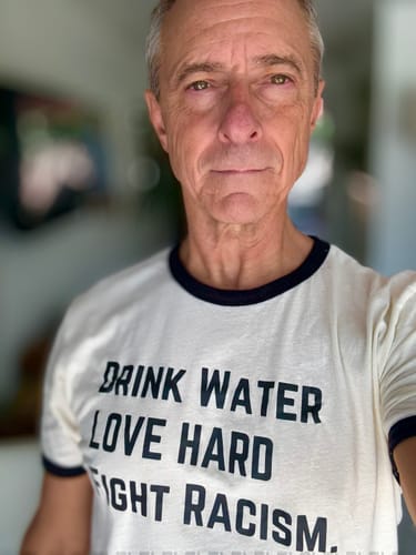 Customer photo review of Drink Water Fight Racism Unisex T-shirt