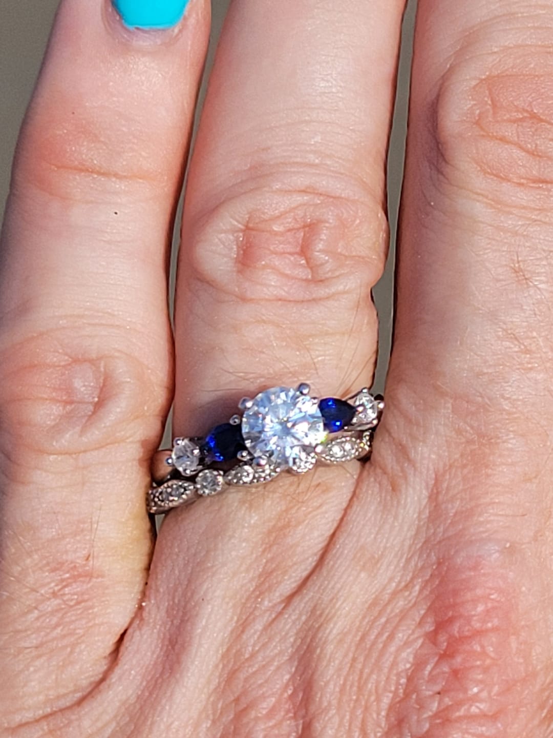 Customer photo review of Five Stone Moissanite And Sapphire Engagement Ring
