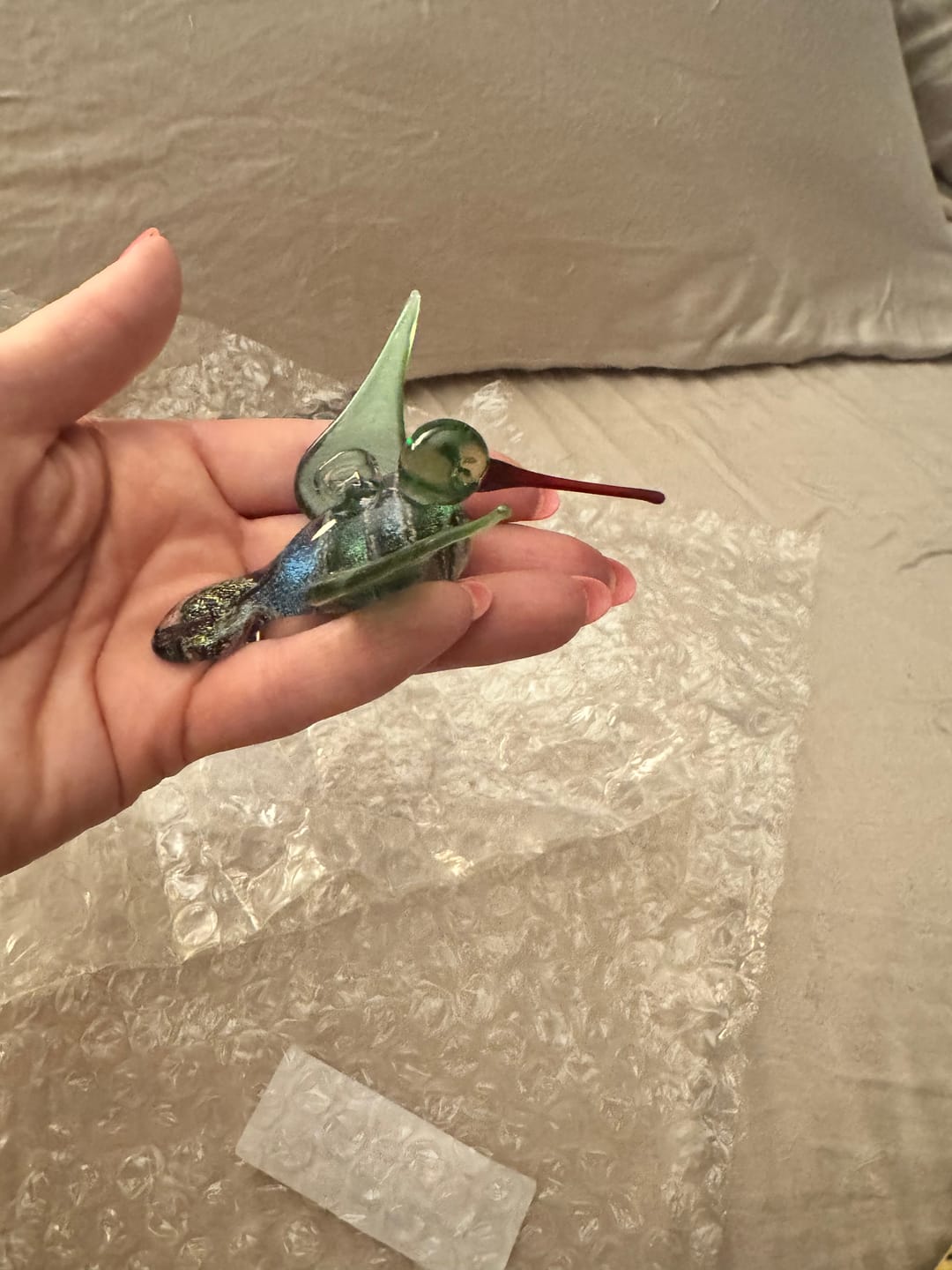 Customer photo review of Dichroic Twist Glass Hummingbird with Infused Ash