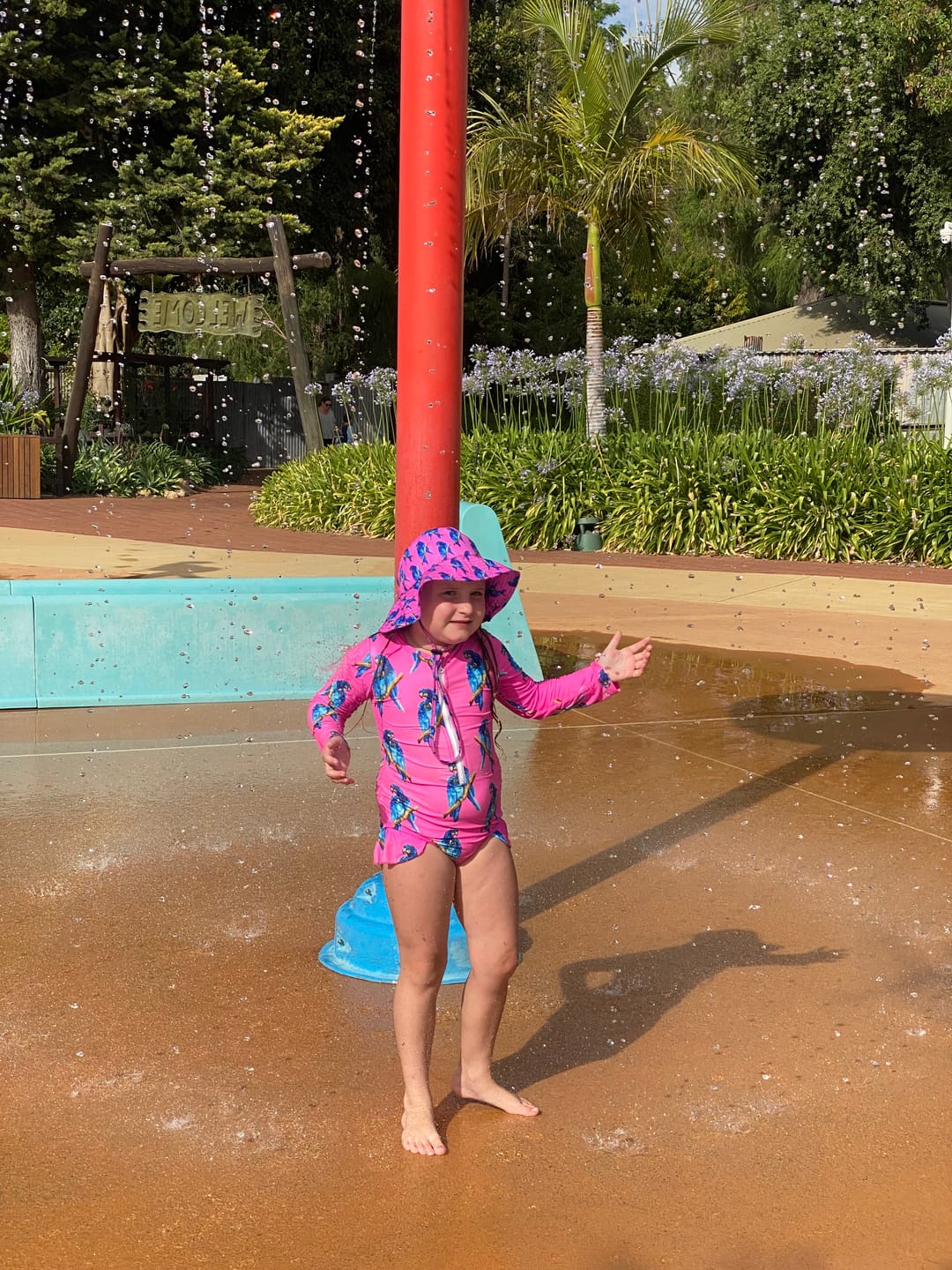 Customer photo review of Fluro Macaw Girls Long Sleeve Zip Swimmers
