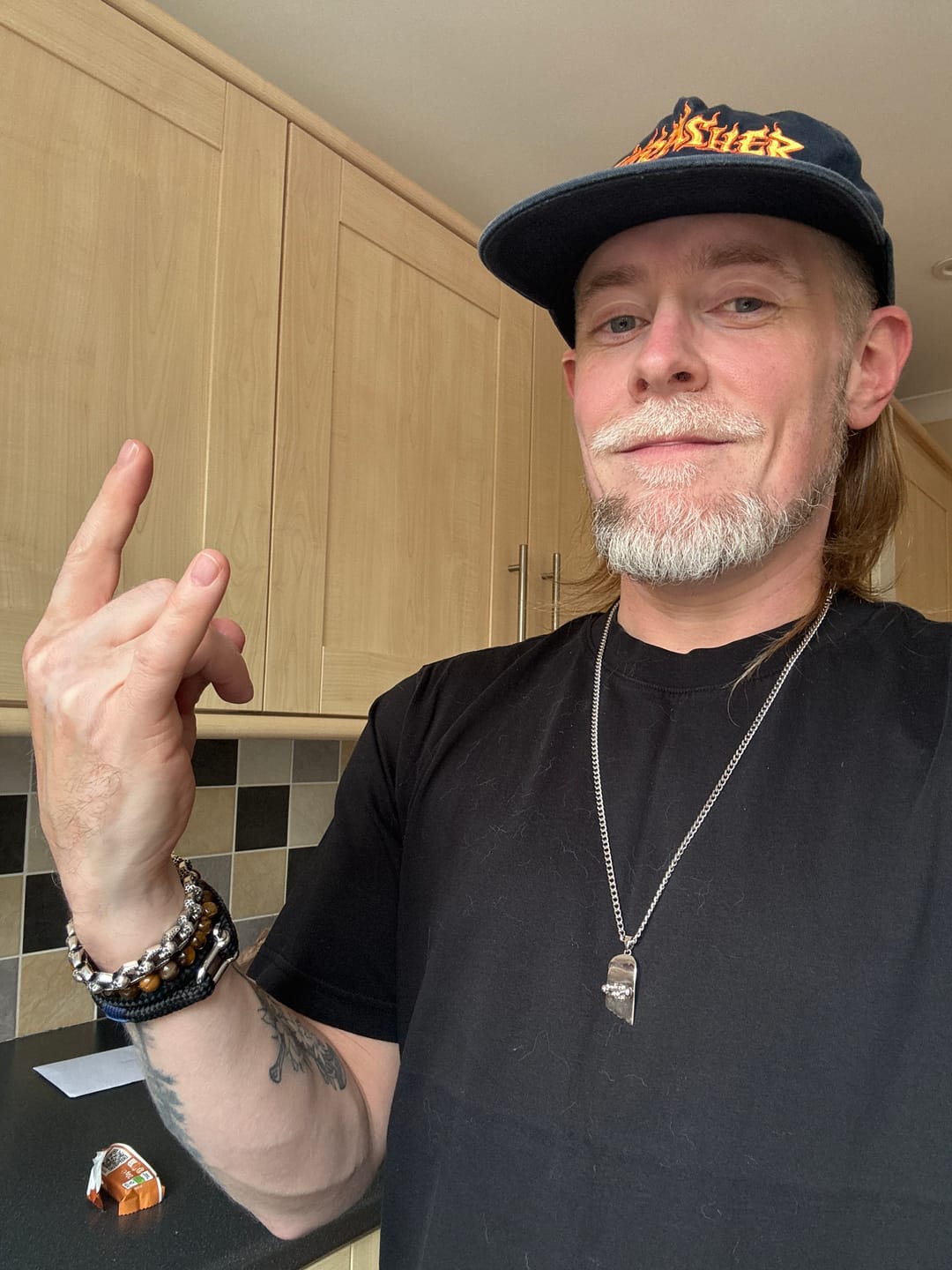Customer photo review of Broken Skateboard Pendant (Silver)