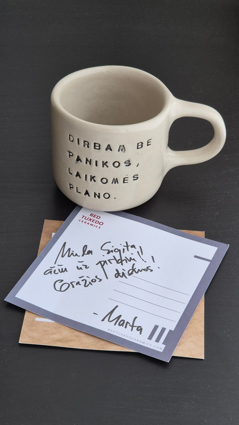 Customer photo review of White ceramic mug with words about work