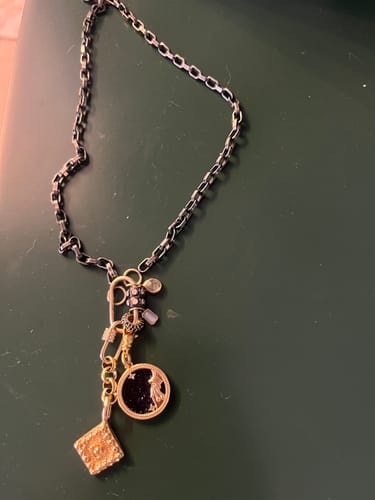 Customer photo review of Black & Gold Zodiac Charm