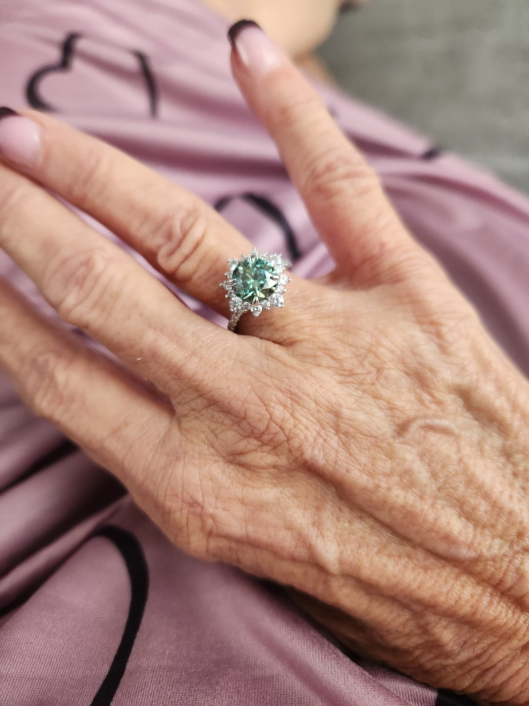 Customer photo review of S925 Moissanite 2 Ct Snowflake Design Halo Round Cyan Blue Stone Engagement Ring