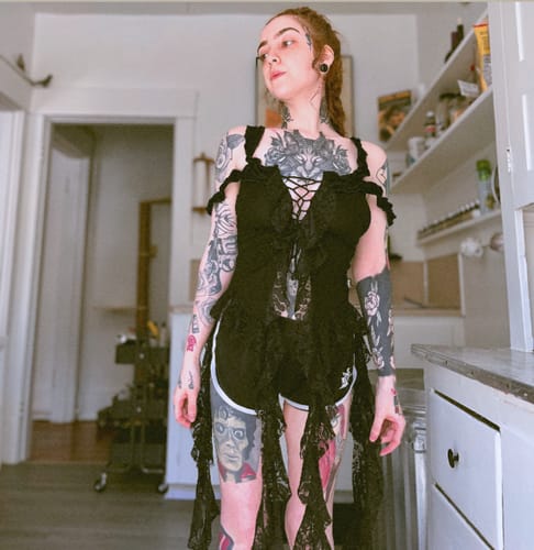 Customer photo review of Off shoulder lace up ruffle lace hem top