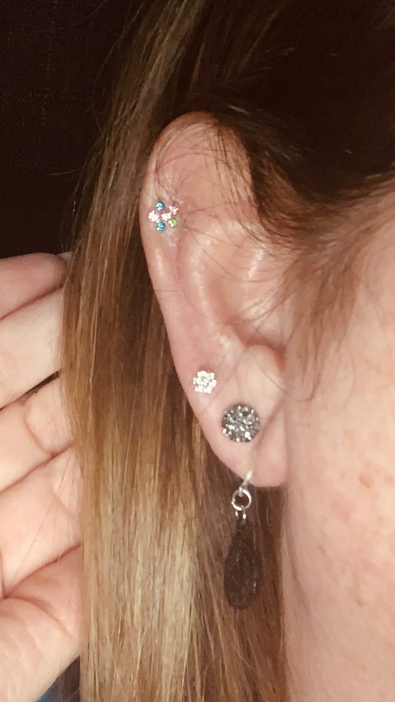 Customer photo review of Tiny Rhinestone Flower Earrings Studs Hypoallergenic Earrings for Sensitive Ears Made with Plastic Posts