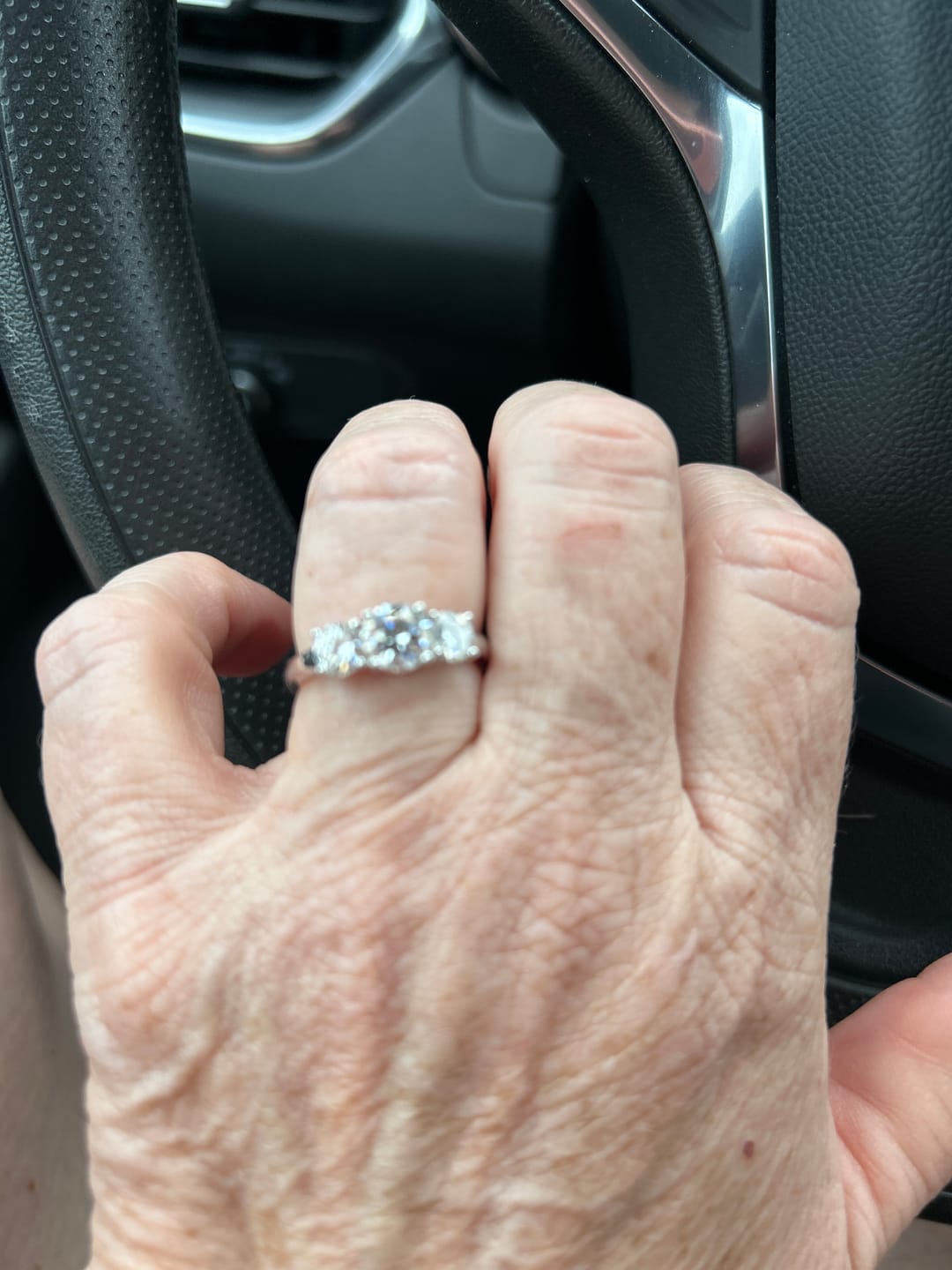 Customer photo review of Classic Three Stone Round Cut Moissanite Engagement Ring