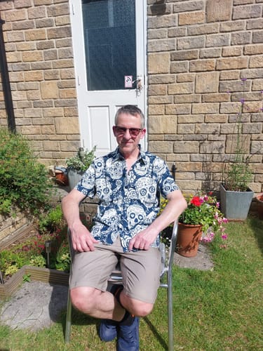 Customer photo review of Men's Sugar Skull Floral Print Cool Button Up Funny Short Sleeve Hawaiian Shirt
