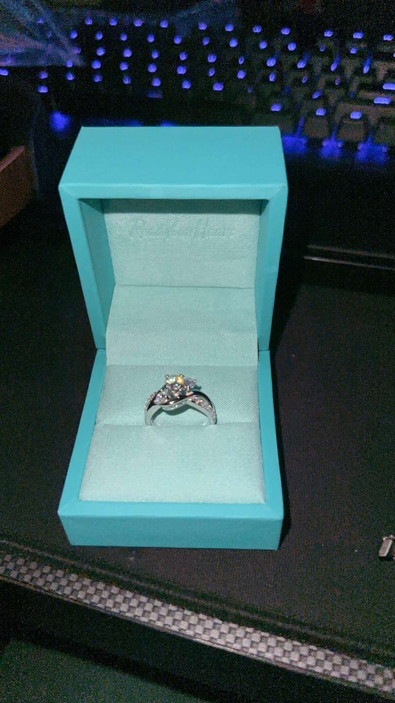 Customer photo review of Swirl Three Stone Moissanite Twisted Pave Engagement Ring