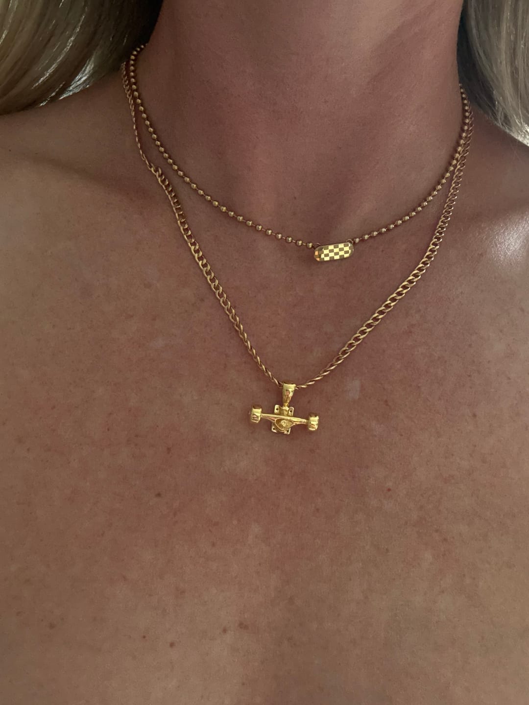 Customer photo review of Skateboard Truck w/Wheels Pendant (Gold)