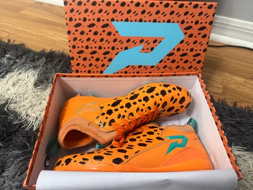 Customer photo review of The Flintstones "Bedrock Blitz" Football Cleats - Quantum Speed by Phenom Elite