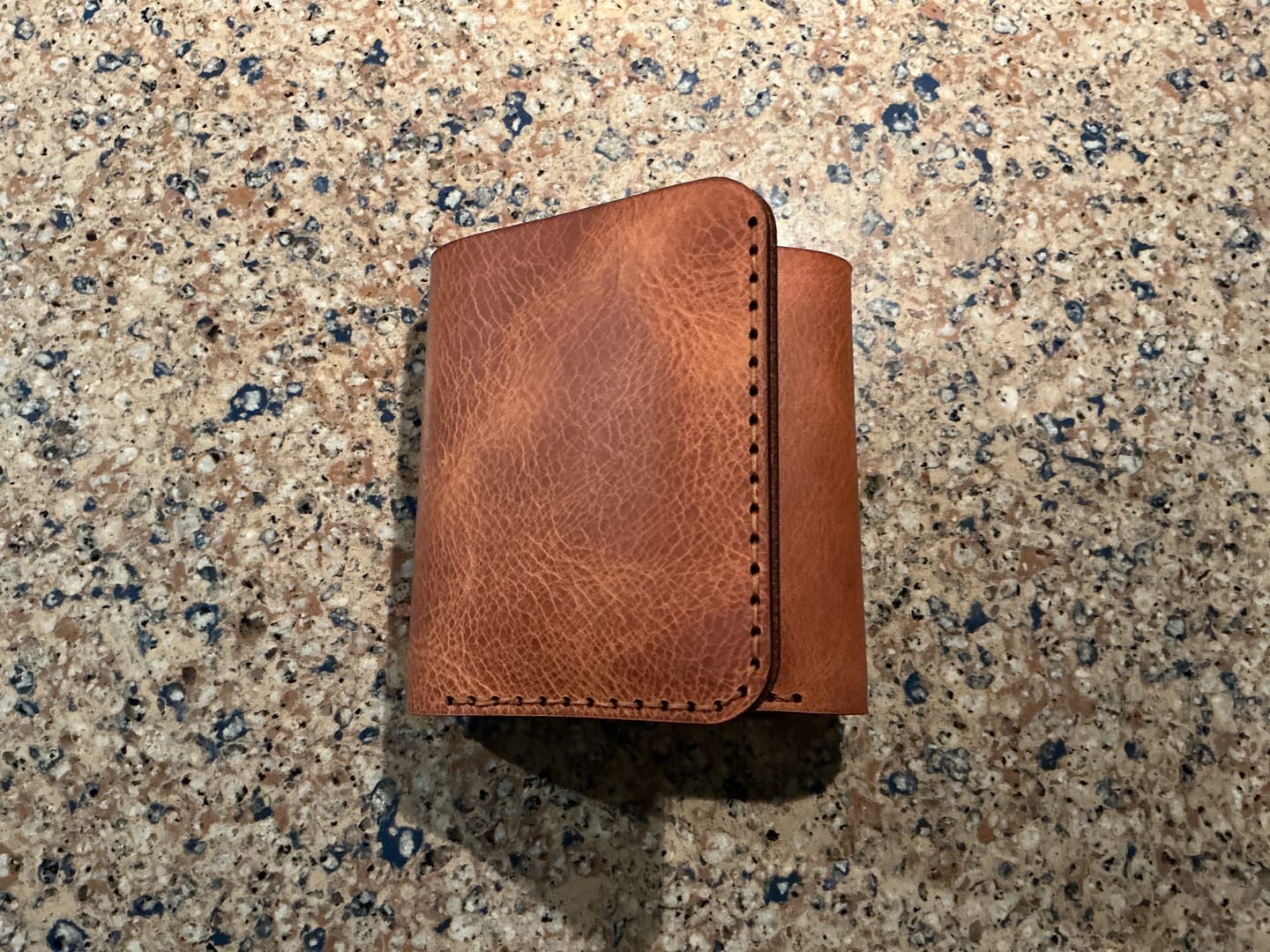 Customer photo review of Badge Trifold Wallet