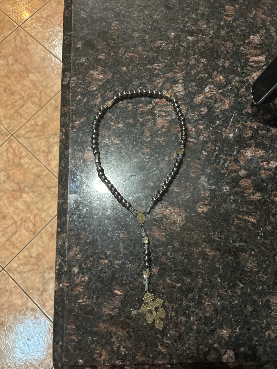 Customer photo review of FREE Today: Miraculous Medal & Crucifix of 8 mm Round Silver Black Gallstone Nylon Cord Rosary
