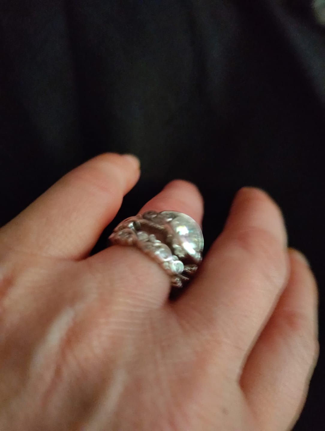 Customer photo review of Bezel Set Round Moissanite Scroll Accents Wedding Band Ring In Sterling Silver