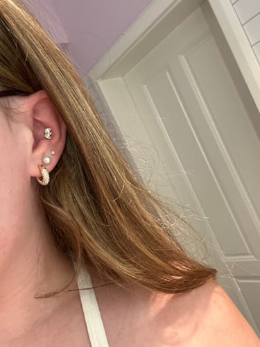 Customer photo review of Limitless Lotus Labret Piercing Gold
