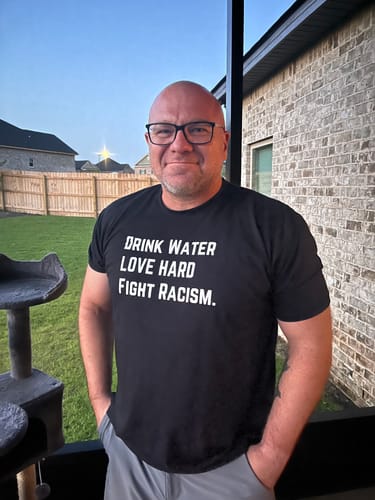 Customer photo review of Drink Water Fight Racism Unisex T-shirt