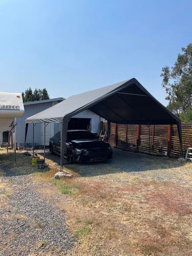 Customer photo review of REIBII 20x20 Heavy-Duty Carports for Two Car, Portable Carport Garage with 4 Windows and 3 Roll-up Doors, Waterproof Carport Canopy Protection UV50+