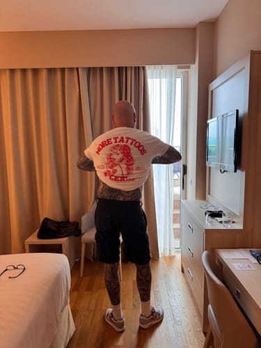 Customer photo review of More Tattoos please - Premium Backprint Shirt