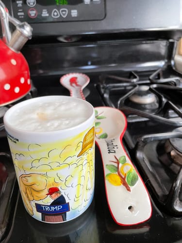 Customer photo review of Black Mug - God's Hand Saving President Trump Political Cartoon Design